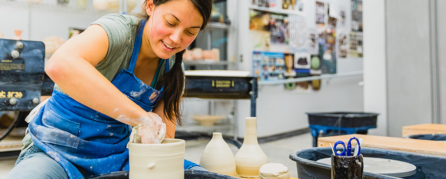 photo of art student making pottery
