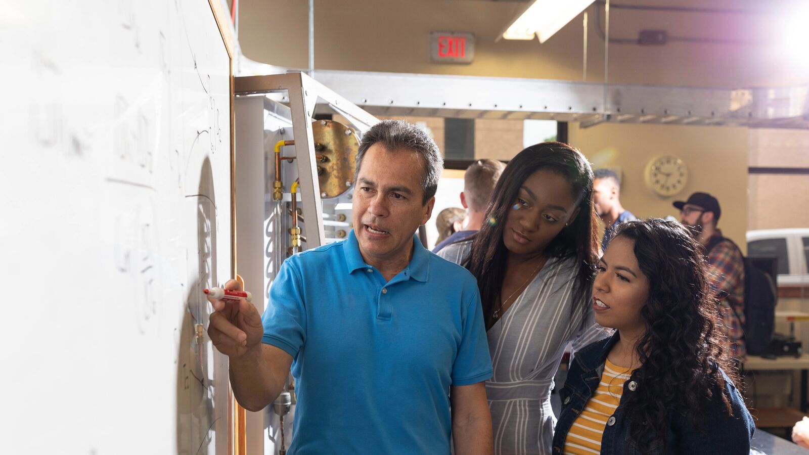 professor and students having a discussion