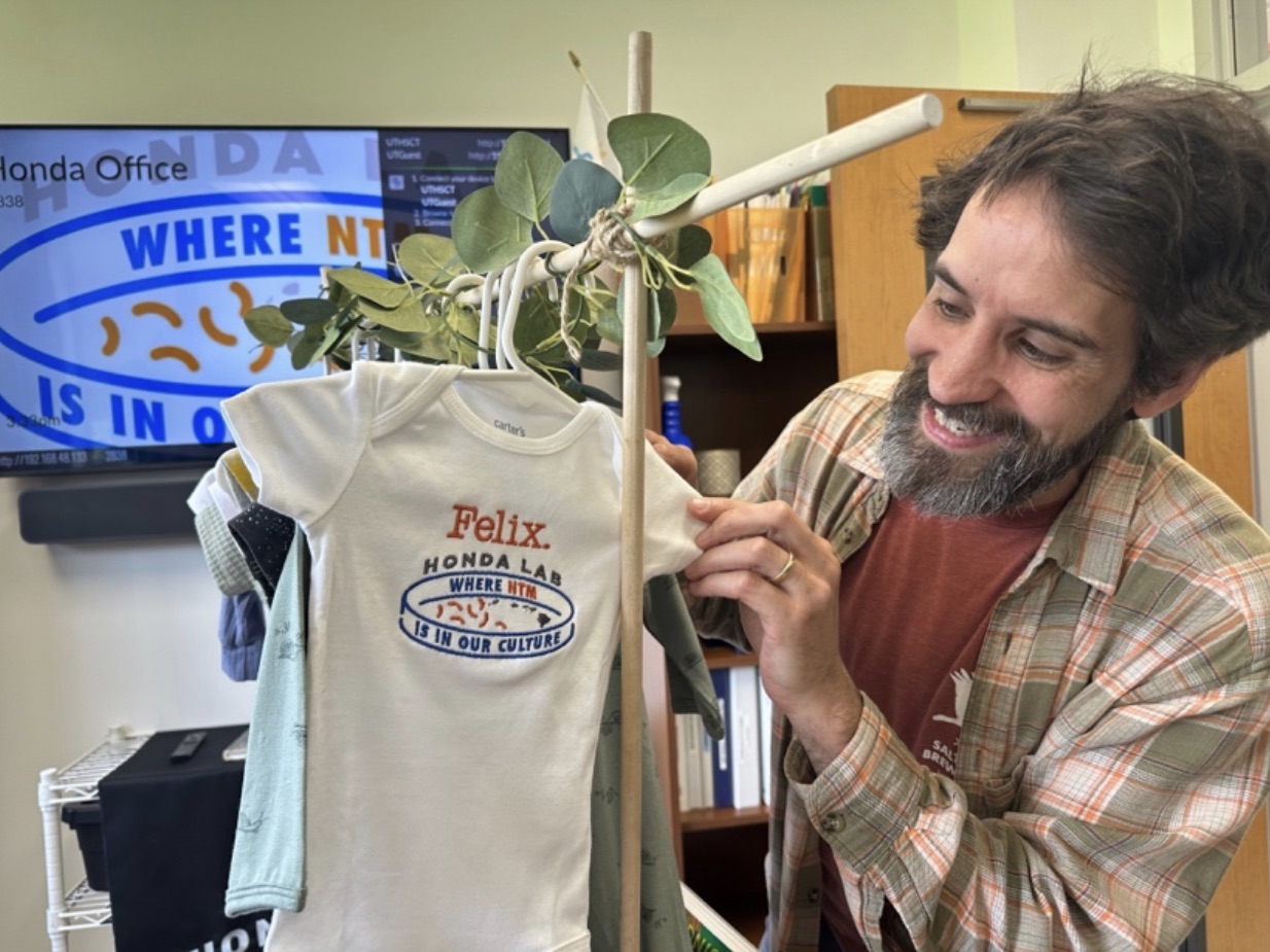 Baby clothes for a baby named felix, with the Honda Lab logo on it.