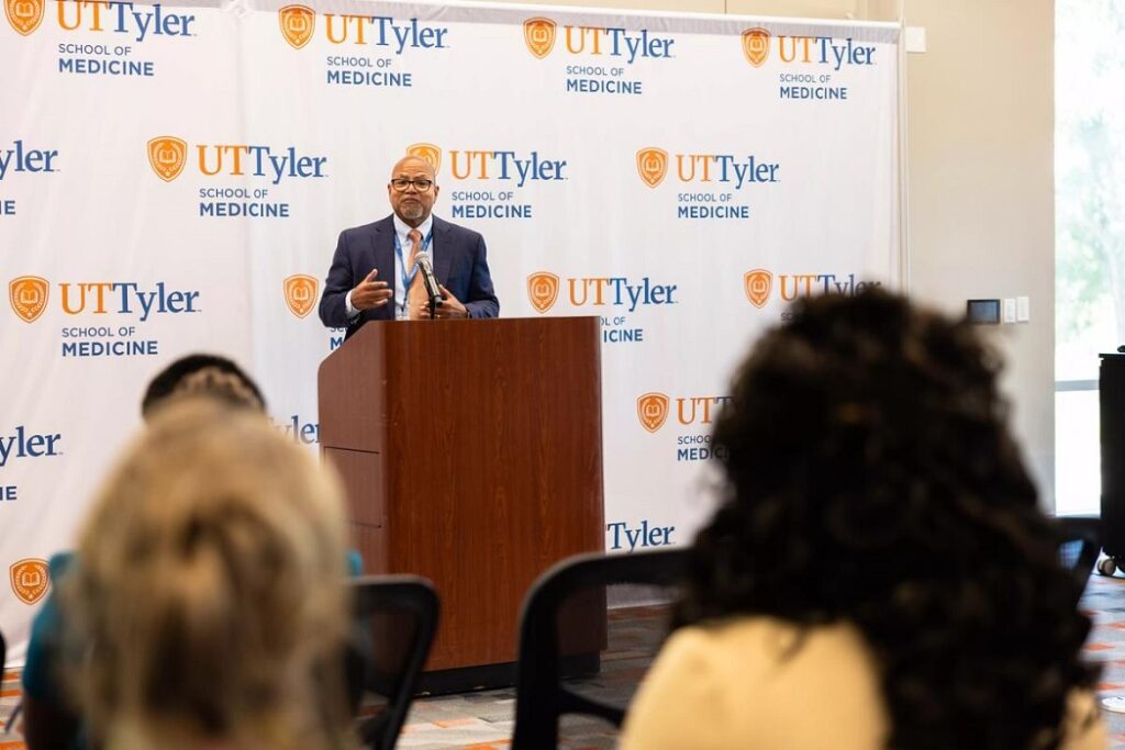 Dr. Calhoun at the Early Assurance Progam signing