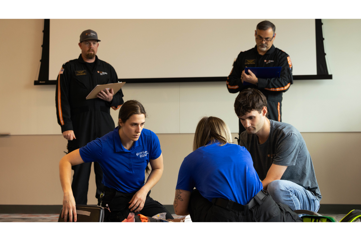 two students performing a simulation