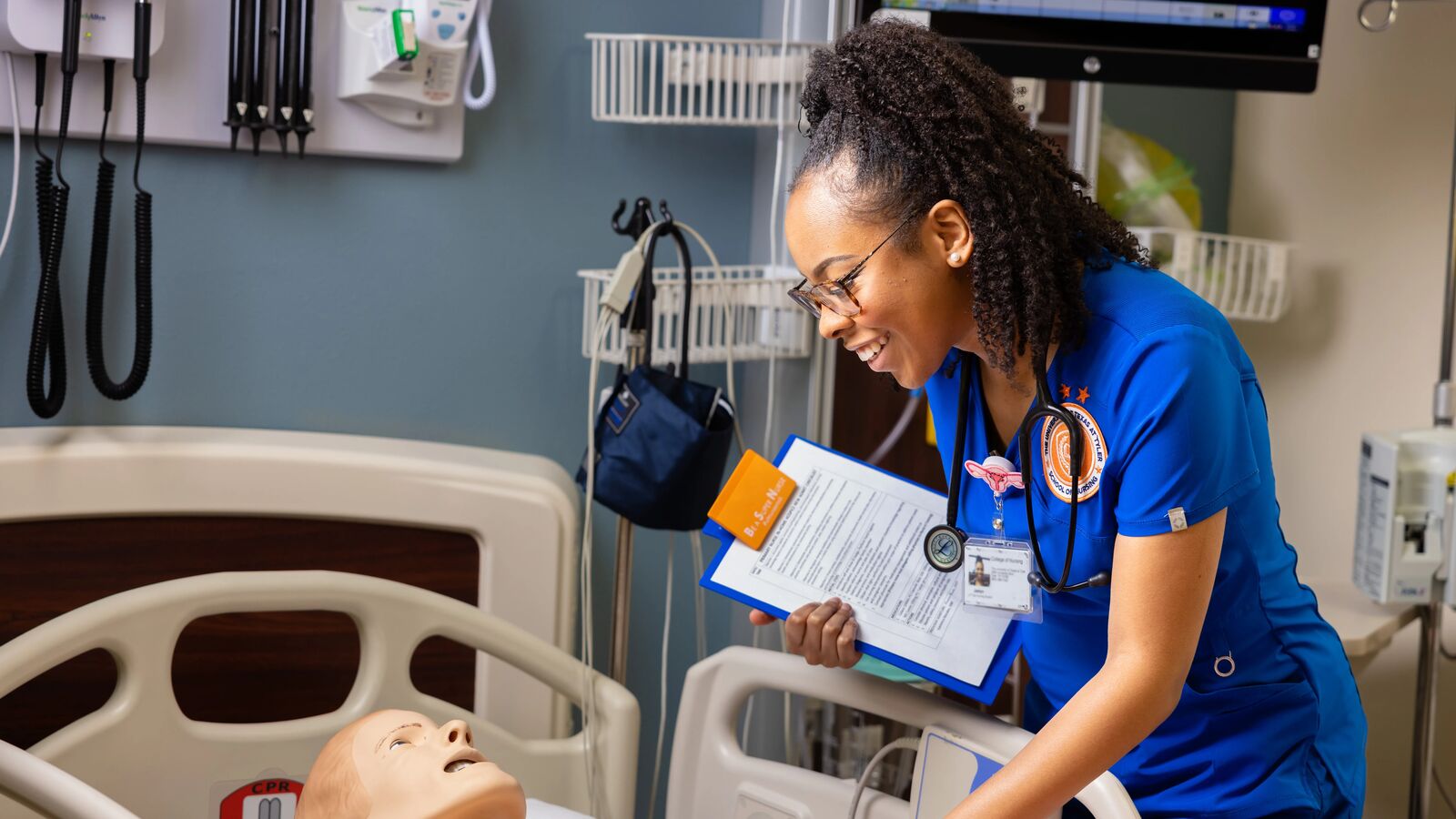 Nursing student with simulation dummy
