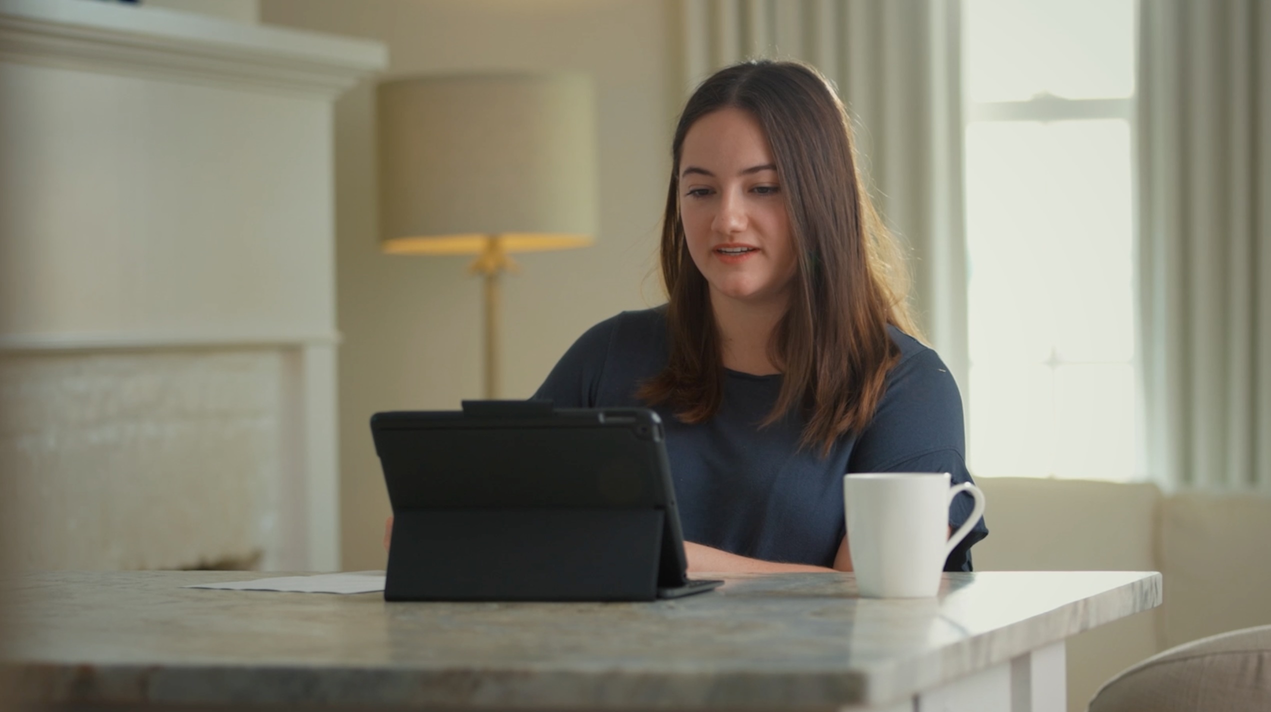 Girl studying at a laptop with her cup of coffee