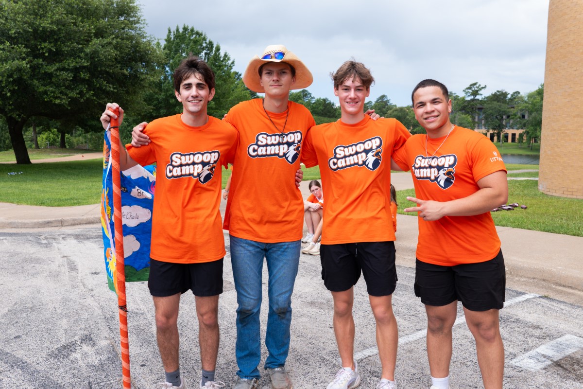 Four Students wearing orange shirts for Family