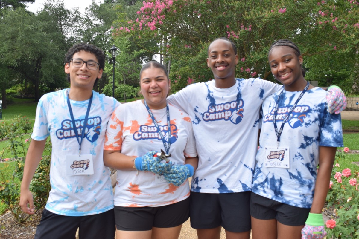Four students standing for Swoop Camp