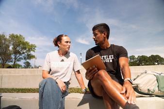 female and male student talking
