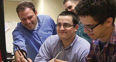 UT Tyler students working together on project in front of computer