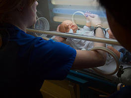 nursing students in university's sim hospital with baby