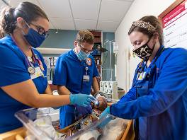 UT Tyler student nurses caring for sim baby