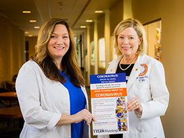 LUC Faculty with poster