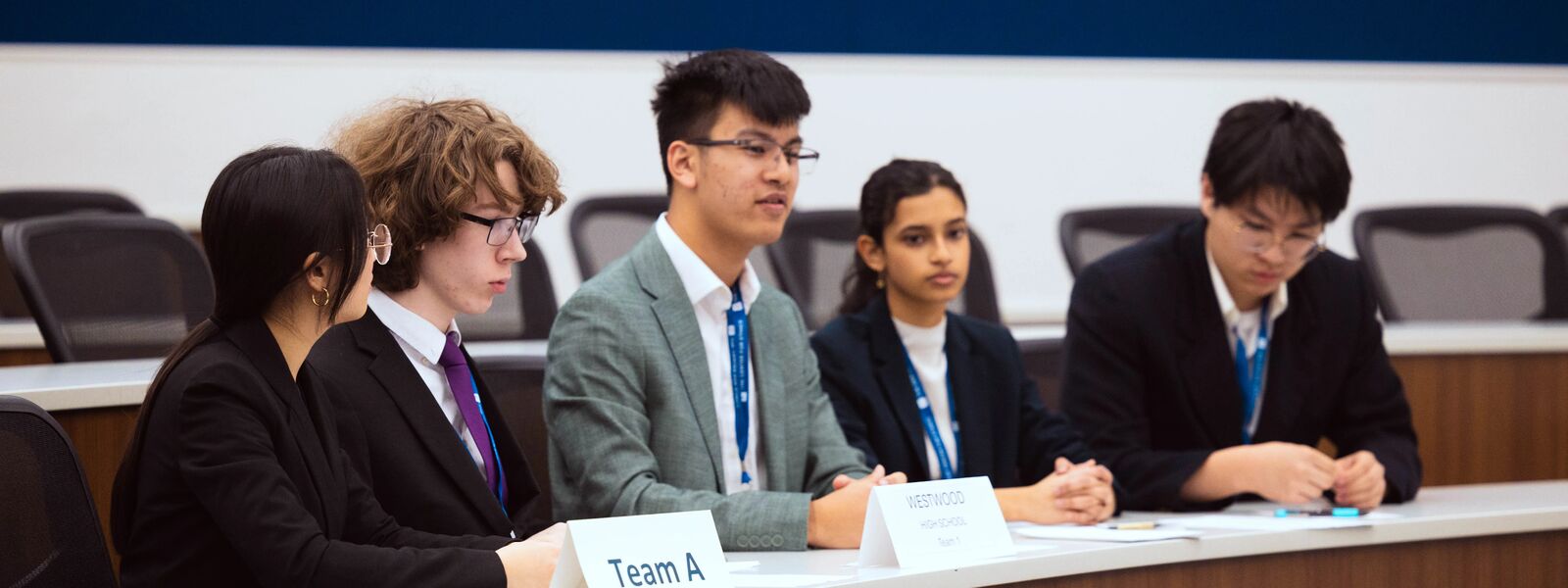 Students sitting at the Ethics Bowl